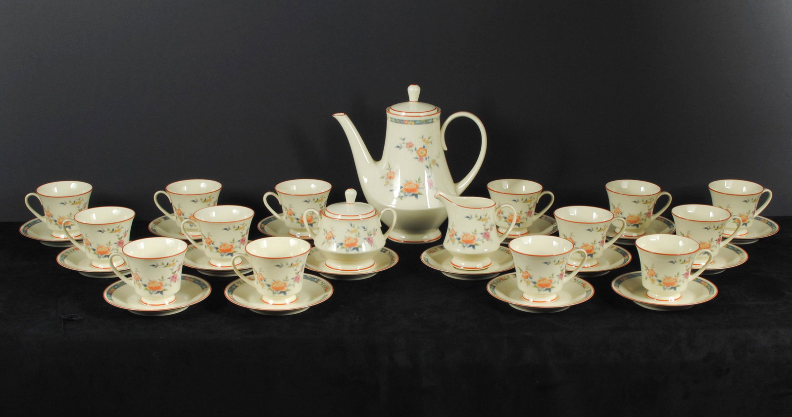 Noritake China Tea Set China Song 8165W83 (33 Pcs) Rare: This is a beautiful Noritake China tea set, for 14. The model is called China Song 8165/W83 pattern. This set has an Asian floral design. It is cream coloured with pink, orange and blue flowers. These