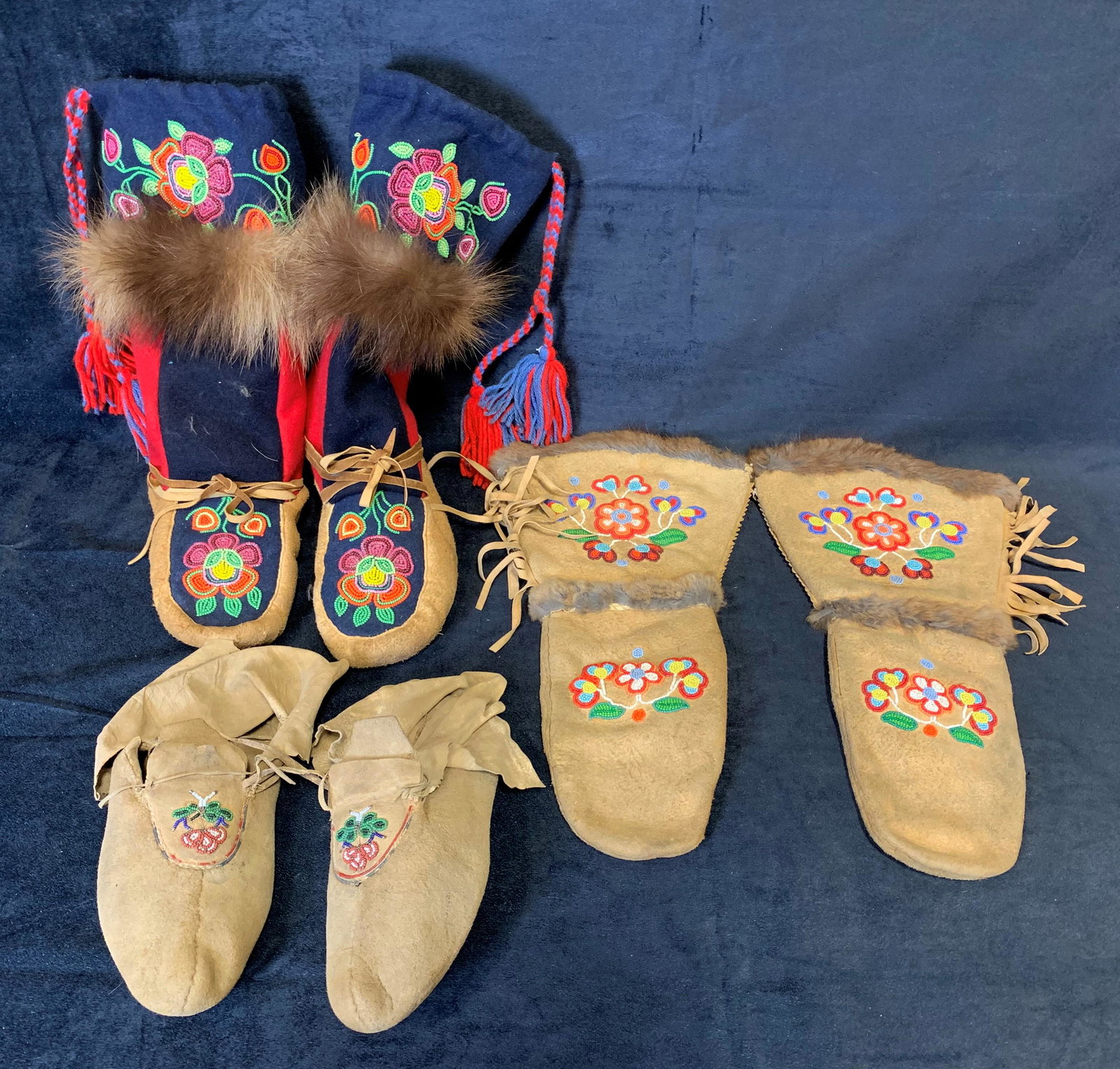 Original Hand Made Inuit Boots & Gloves: A collection of 2 pairs of original hand made Inuit boots and 1 pair of original hand made Inuit gloves. Each have a beaded pattern, are full adult size, and are in great condition.