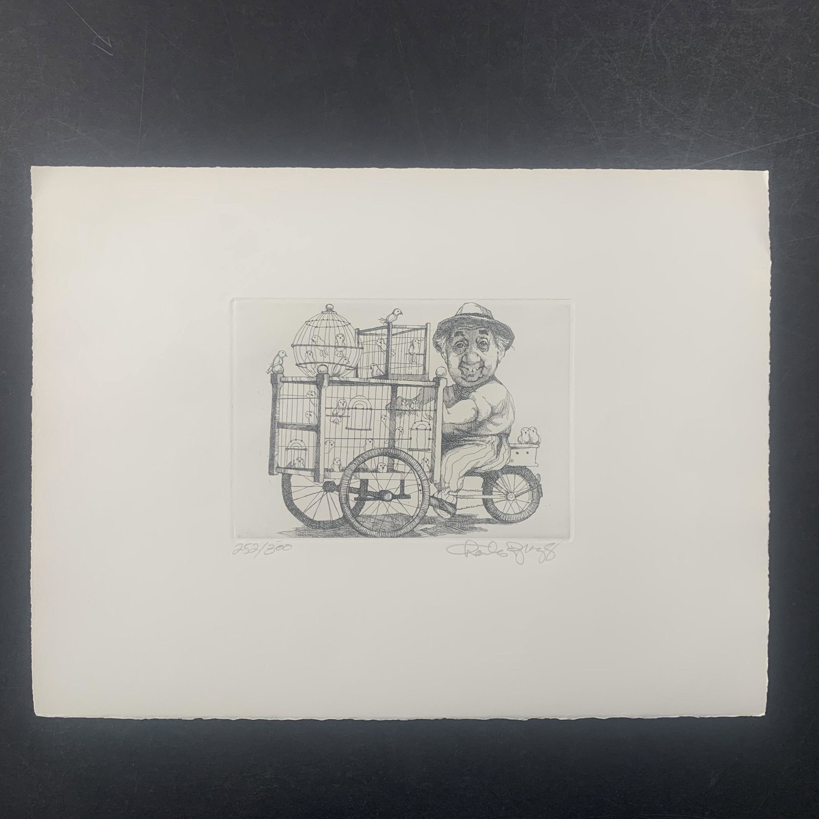 Charles Lynn Bragg's "Birdman" Limited Edition Print: Charles Lynn Bragg's "Birdman" limited edition print, signed lower right and numbered 252/300 lower left. This piece is of an elderly man riding a bicycle, equipped with bird cages. This piece is in e