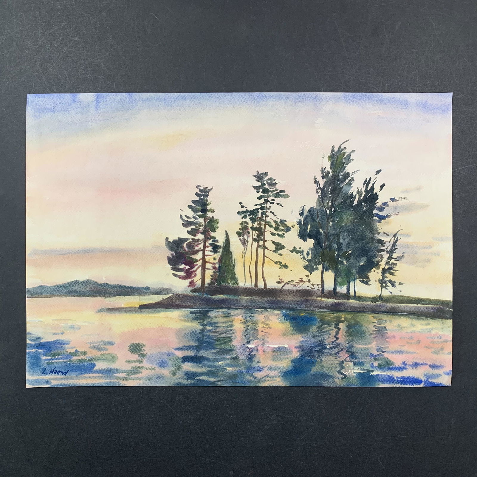 L. Marton' s "Reflections" Original Print: L. Marton' s "Reflections" original print. This piece is of a trees in the midground, surrounded by a body of water, as the sun is setting in the distance, done in a watercolour style. This piece is i