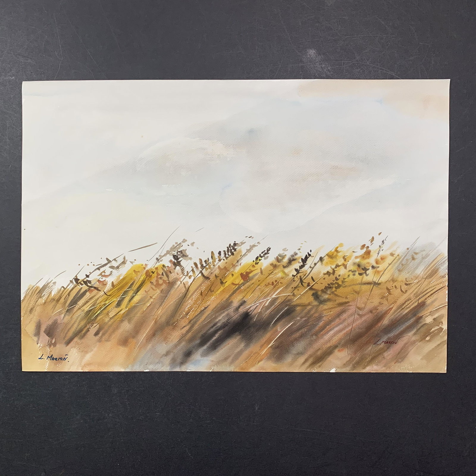 L. Marton's "Wheat Field" Original Print: L. Marton's "Wheat Field" original print. This piece is depicts a field of wheat growing, and has been done in a watercolour style. This piece is in good condition with a minor crease (14") from left 