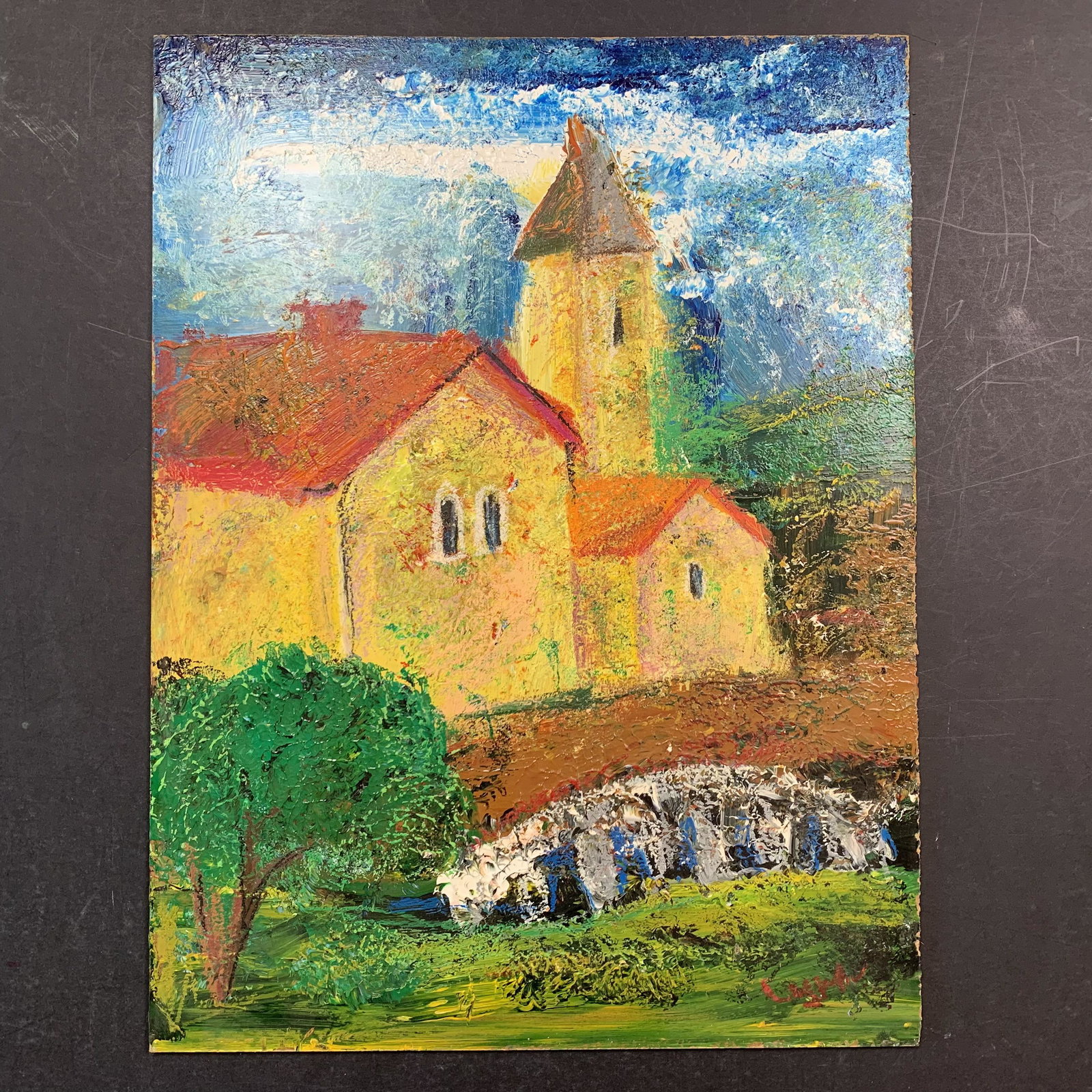 Maya Eventov, Untitled, Original Oil on Board: Maya Eventov, Untitled, Original Oil on Board. A small group of buildings is on the other side of a bridge which crosses the stream. The artist has added some rich texture to this painting. It is in e
