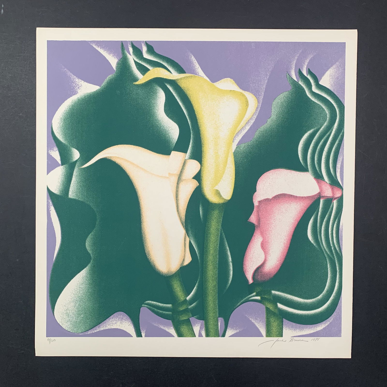 Jack Brusca's "Calla Lilly" Limited Edition Print: Jack Brusca's "Calla Lilly" limited edition print, signed and dated lower right, and numbered 94/200 lower left. This piece is of 3 flowers with peach, yellow and pink petals. This piece is in excelle