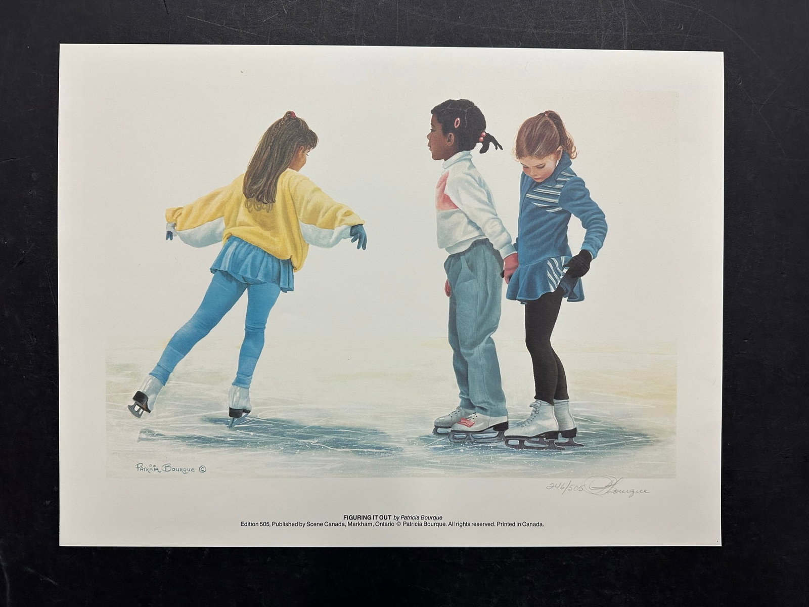 Patricia Bourque's "Figuring it Out" Limited Edition Print: Patricia Bourque's "Figuring it Out" limited edition print, signed and numbered 246/505 lower right. A lovely piece of three young girls learning to figure skate. This print is in mint condition, has 