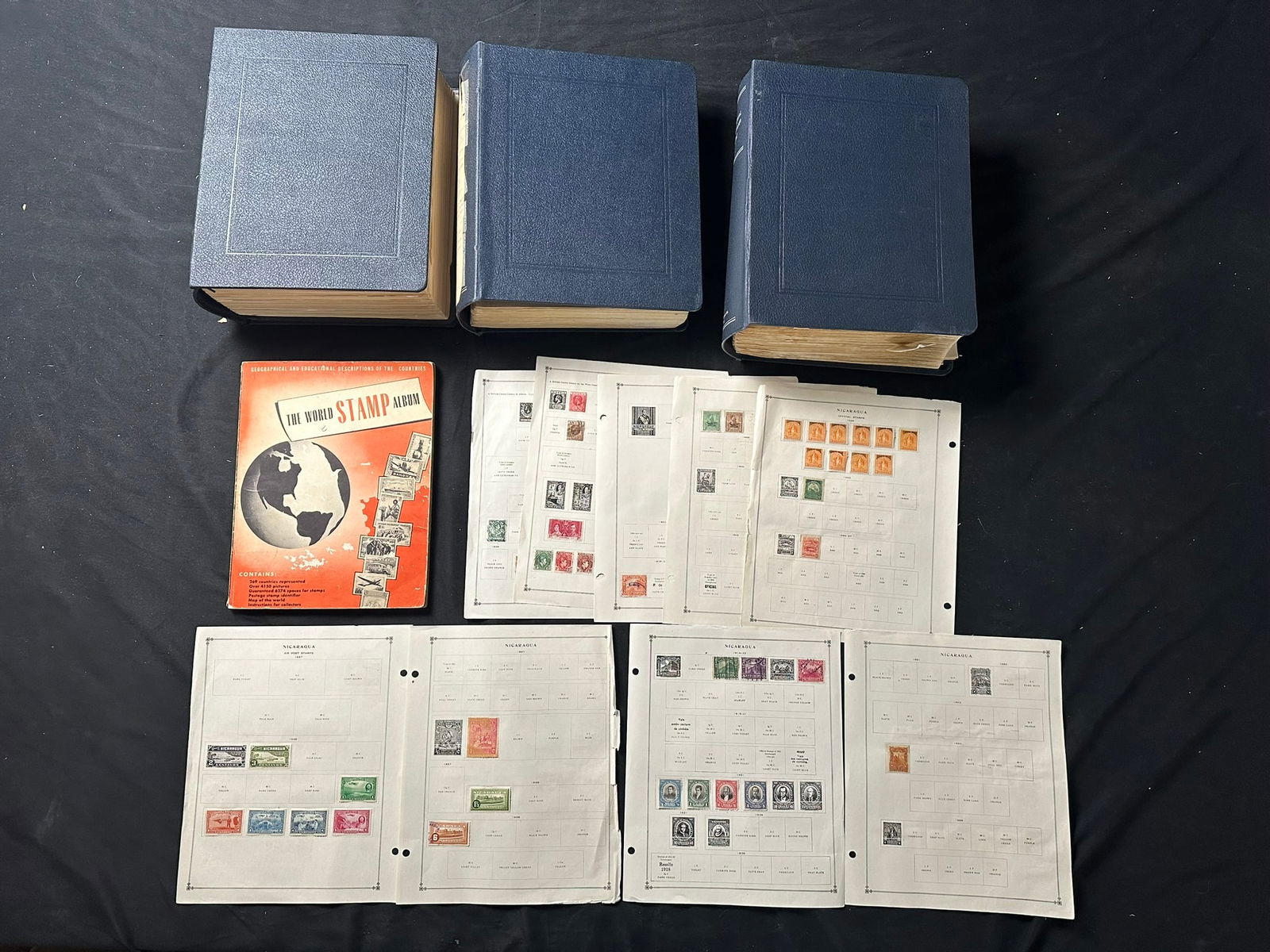 A large S-Z accumulation mostly used in three 'International Postage Stamp Album' (1 of 4)