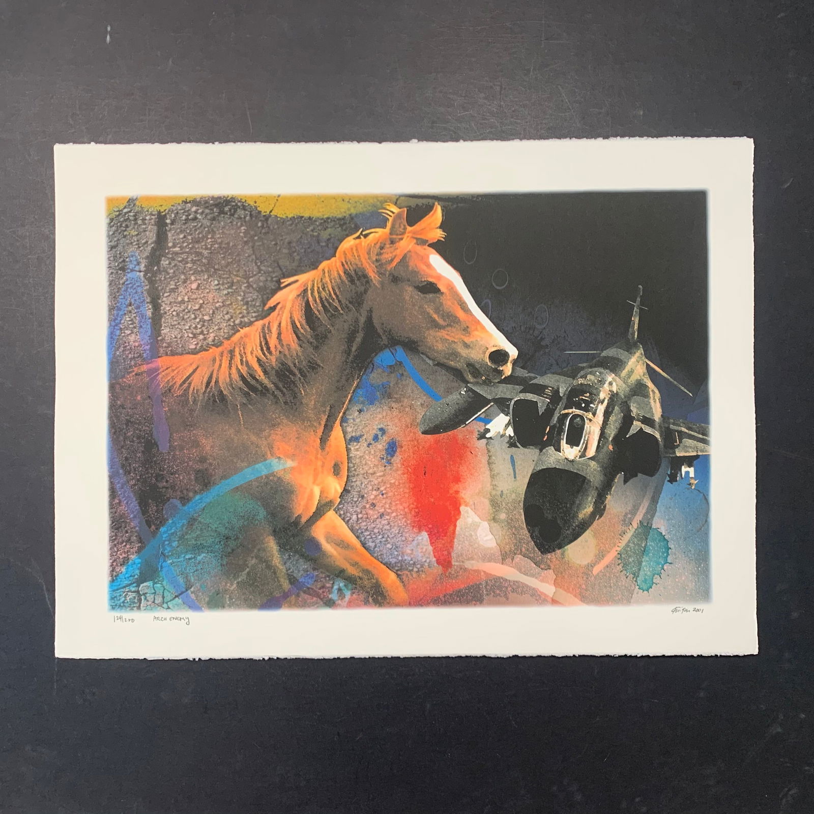 Michael Knigin's "Arch Enemy" Limited Edition Print: Michael Knigin's "Arch Enemy" limited edition print, signed lower right and numbered 124/200. This piece is of a close up of a horse, as well as an army fighter plane. Image: 17 3/4" x 25 3/4". Paper: