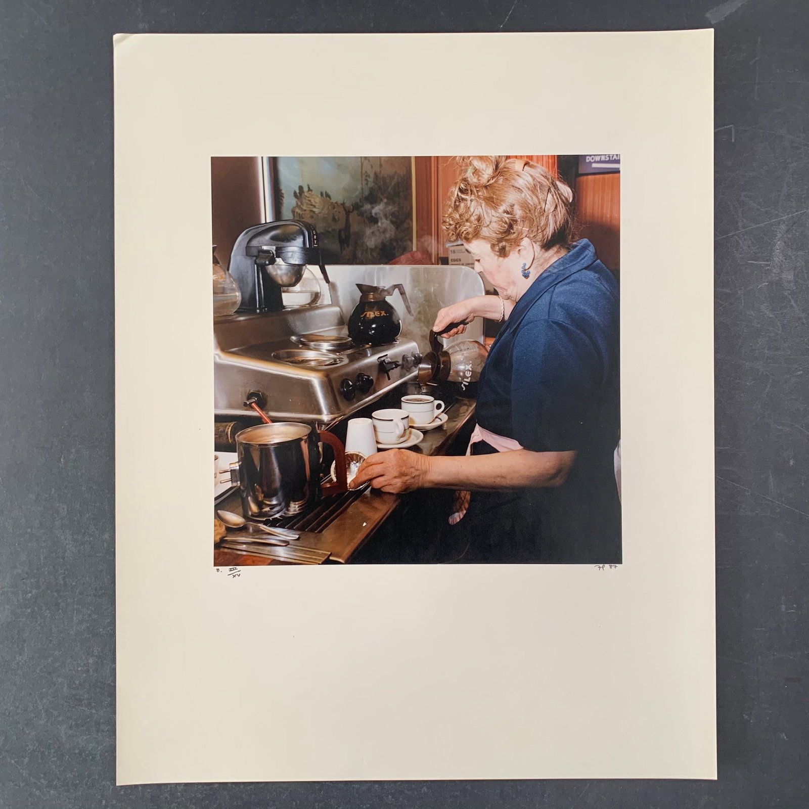 Untitled Limited Edition Photograph: Untitled Limited Edition Photograph. A server at the local diner pours a cup of coffee for her patron. This photo is numbered III/XV and is in very good condition. Image: 11" x 11". Paper: 16" x 20".