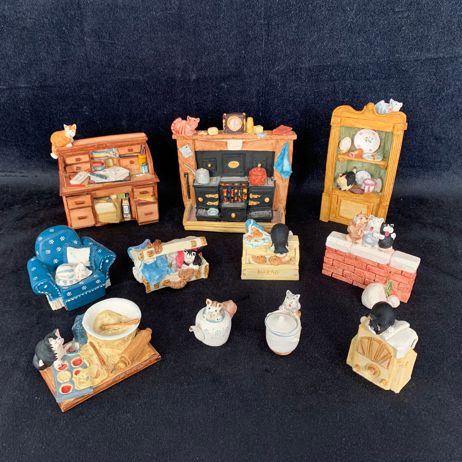 Peter Fagan Cat Figurines: A grouping of 11 Peter Fagan car figurines. These whimsical pieces are perfect for the cat lover. Each has been hand painted and everything is in pristine condition without any signs of wear or damage