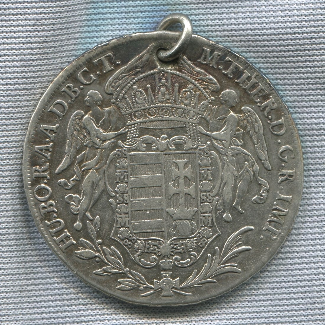Hungary 1780, Madonnentaler silver coin, please note the coin has been made into a pendent, with a: Hungary 1780, Madonnentaler silver coin, please note the coin has been made into a pendent, with a hole and ring at the top, the reverse of the coin is virtualy as orginal struck,