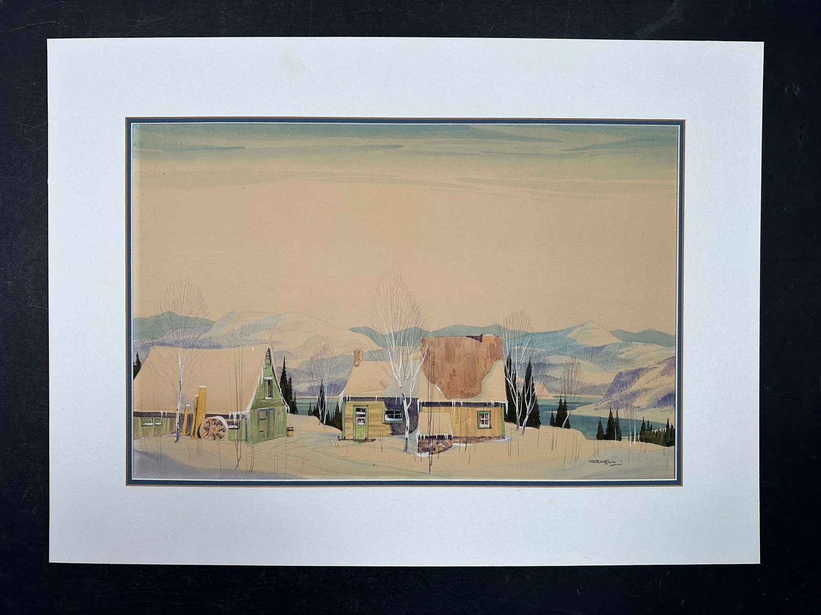 Graham Noble Norwell's "Winter Cottage by the Laurentians" Original: Graham Noble Norwell's "Winter Cottage by the Laurentians" original watercolour, signed lower right, professionally double matted. Done in Norwell's signature style, a cab sits by the river's edge, in