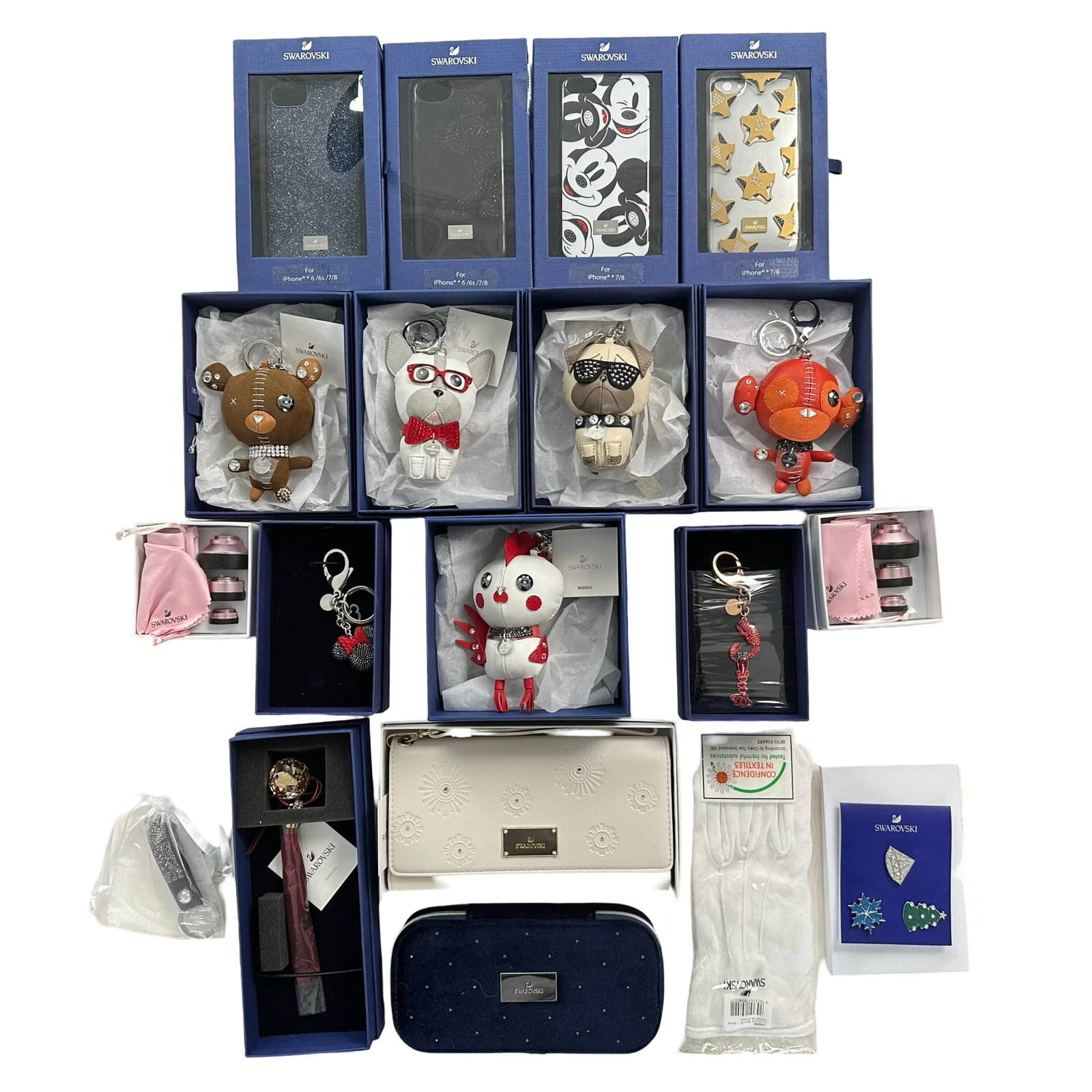 Swarovski Accessories: A group of Swarovski accessories, containing twenty pieces. Each in mint condition, and included in its original box "Bruno Bag Charm" #5352911, "Arnold Brown Bag Charm" #5039235, "Rooster Pascal Bag 