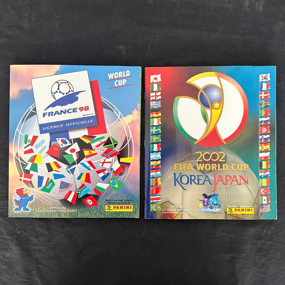 Panini 1998 and 2002 FIFA World Cup Complete Sticker Sets: Panini 1998 France and 2002 Japan FIFA World Cup complete sticker sets. All placed in their correct spots, overall in excellent condition.
