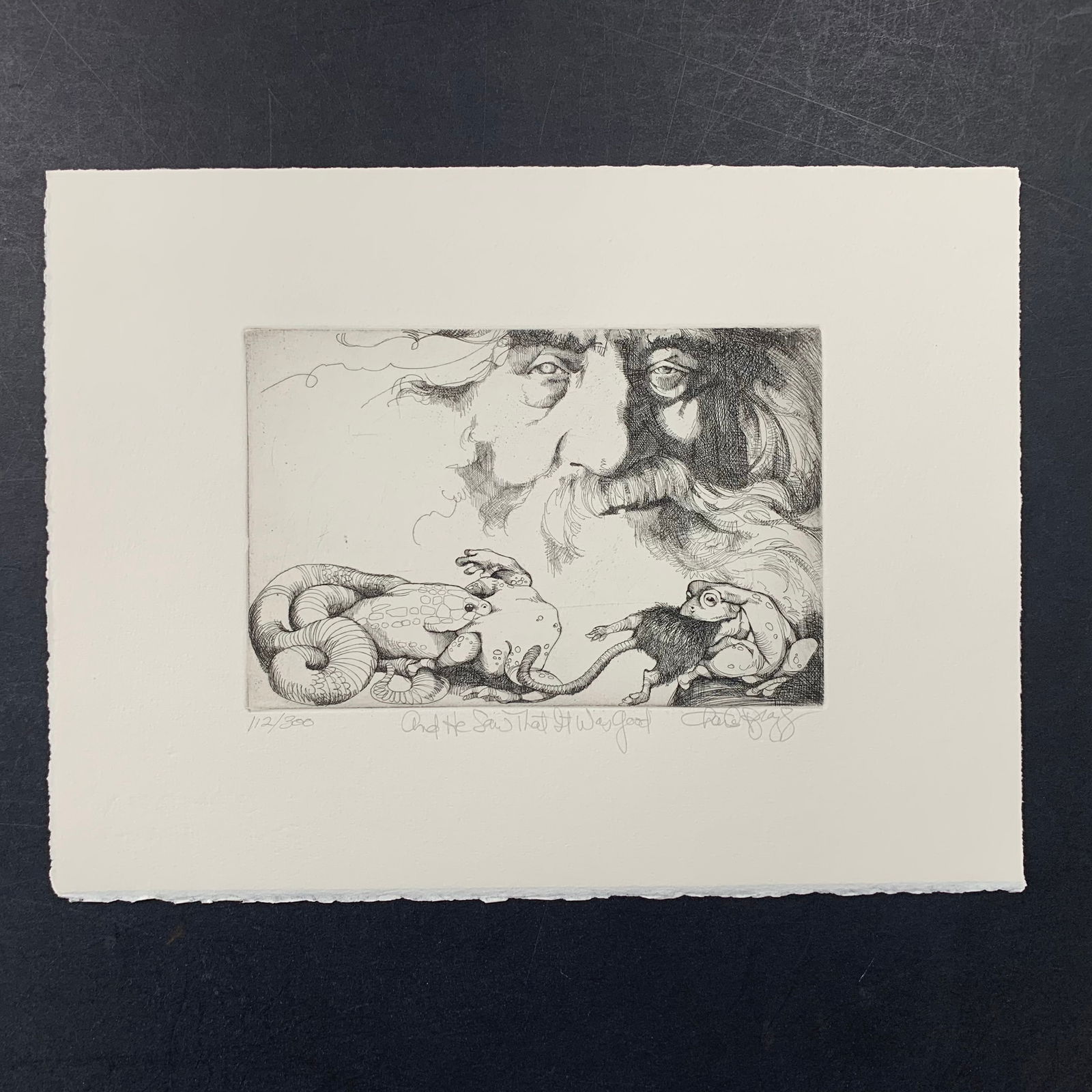 Charles Bragg's "And He Saw That it Was Good" Limited Edition Print: Charles Bragg's "And He Saw That it Was Good" limited edition print, signed lower right and numbered 112/300 lower left. This piece is of God watching over a snake and frog feeding, and is in excellen