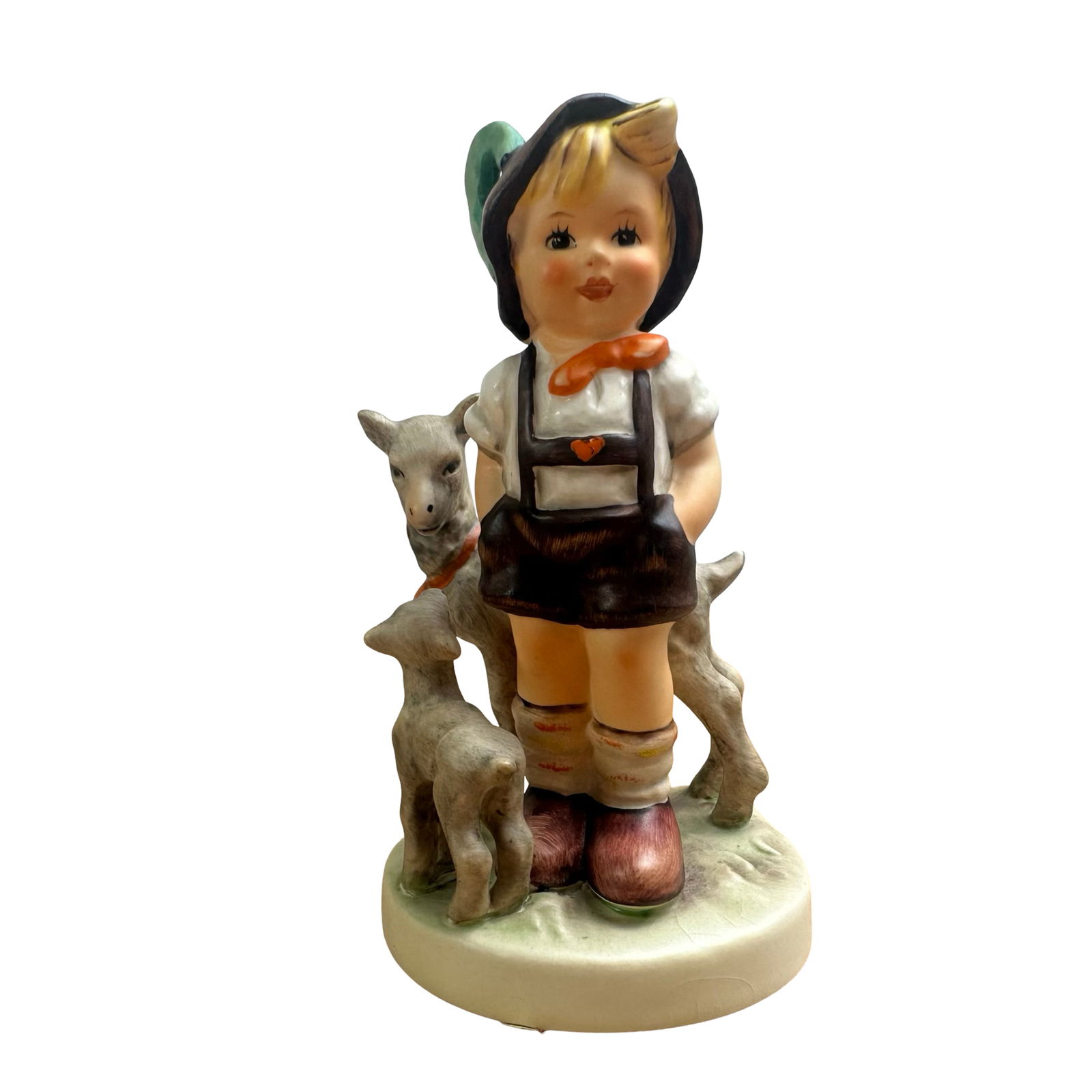 Exquisite Hummel Goebel Figurine “The Goat Herder" #200/0 TMK-5 (Last Bee Mark), West Germany -: Immerse yourself in the timeless charm of this authentic Hummel figurine, titled “The Goat Herder”, model number #200/0, beautifully produced by Goebel in West Germany. This piece masterfully