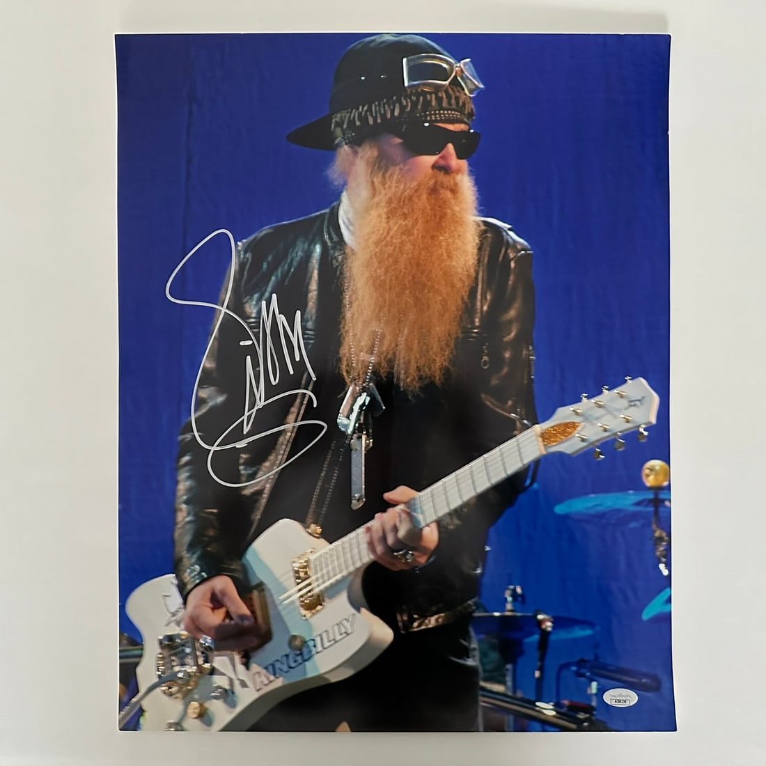 ZZ Top (Billy Gibbons) Signed Photo: An autographed photo of ZZ Top (Billy Gibbons) playing the guitar at a concert. Included with a JSA sticker of authenticity #AC86130. Image: 20" x 16".Memorabilia, Autographs, Signatures, Collectibles