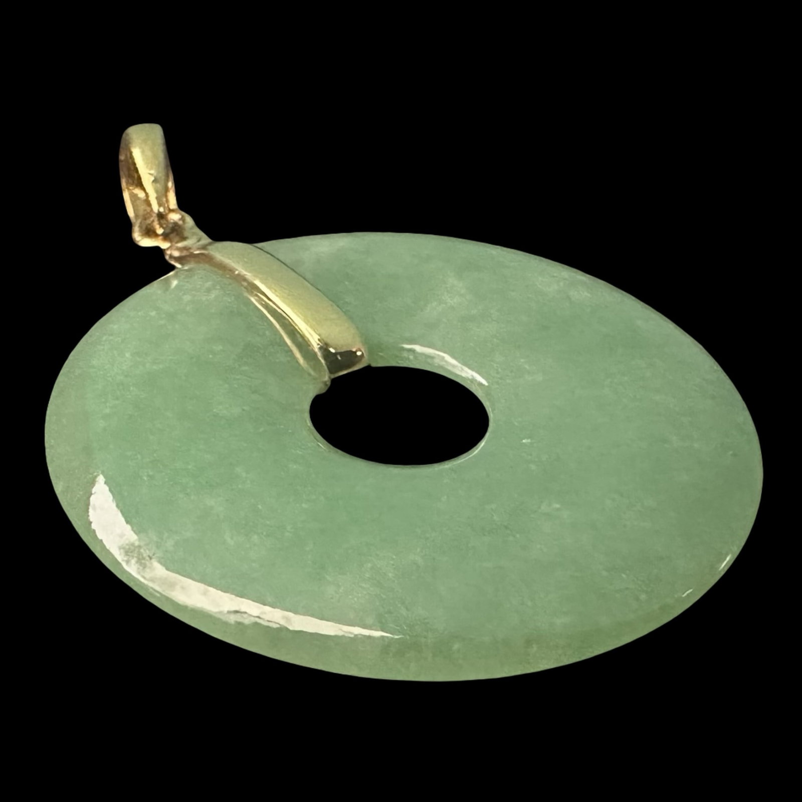 Natural Olive Green Jadeite Bi Disc Pendant with 14K Gold Bail - 26mm: Presented here is a refined natural jadeite jade pendant, elegantly shaped in the traditional bi disc (pi disc) form and measuring 26mm in diameter. Expertly carved from translucent olive green jadeit