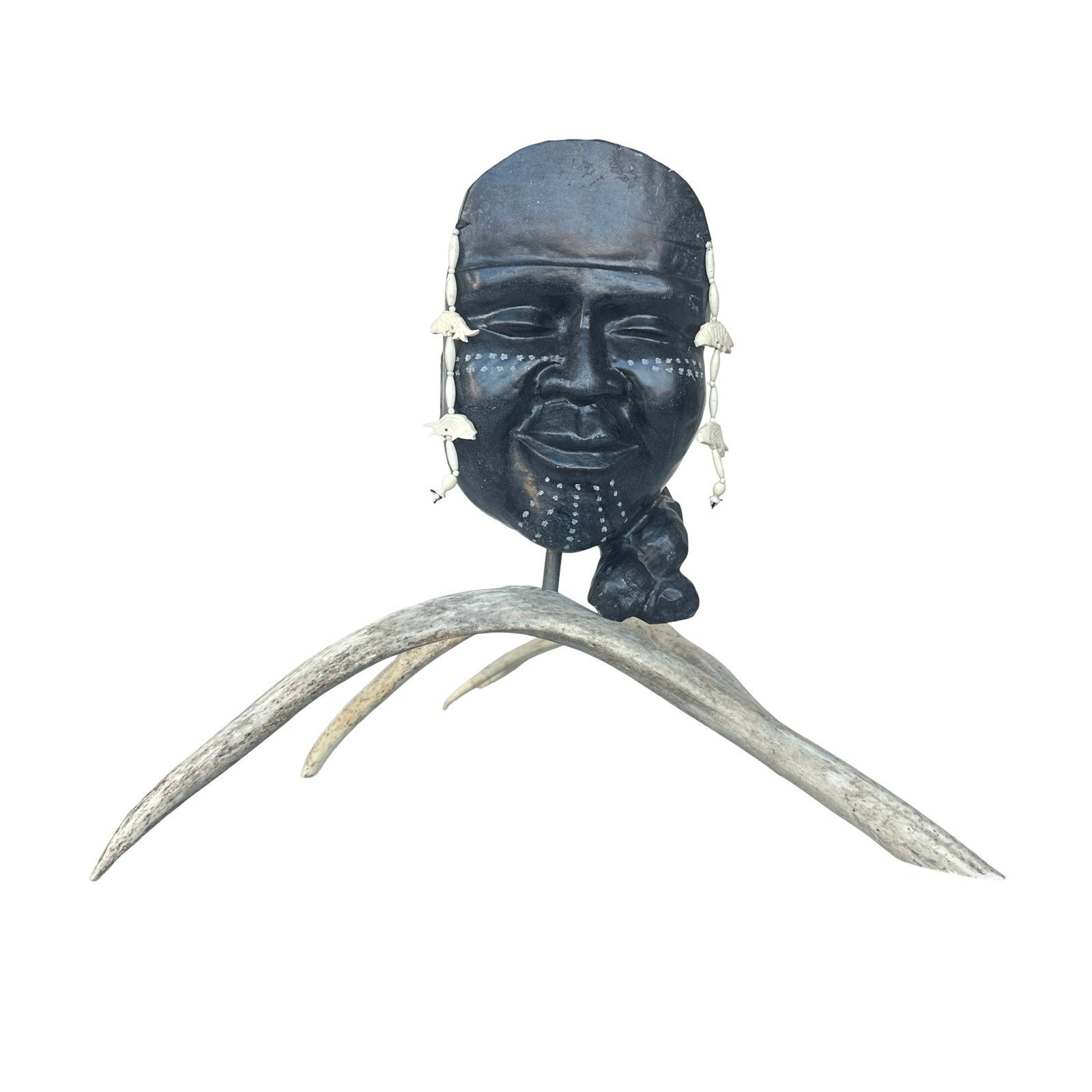 Rachel Botoova - Medicine Woman, 1980 - Inuit Serpentine Stone Mask on Caribou Antler Stand - Pond: A commanding and exquisitely balanced example of historic Inuit art, “Medicine Woman” was carved in 1980 by Rachel Botoova of Pond Inlet, Nunavut, and retains its original Government of Canada