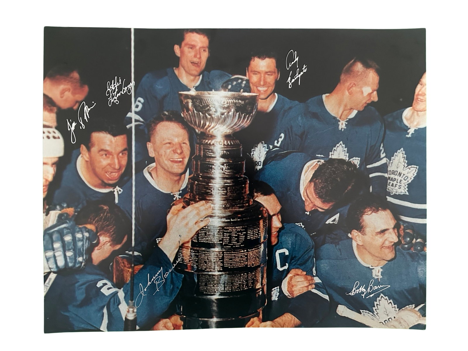 Toronto Maple Leafs 1964 Stanley Cup Signed Photo: An autographed photo of the 1964 Stanley Cup winning Toronto Maple Leafs, signed by five players. Includes Bobby Baun, Johnny Bower, Jim Pappin, Eddie Litzenberger, and Andy Bathgate. Included with a