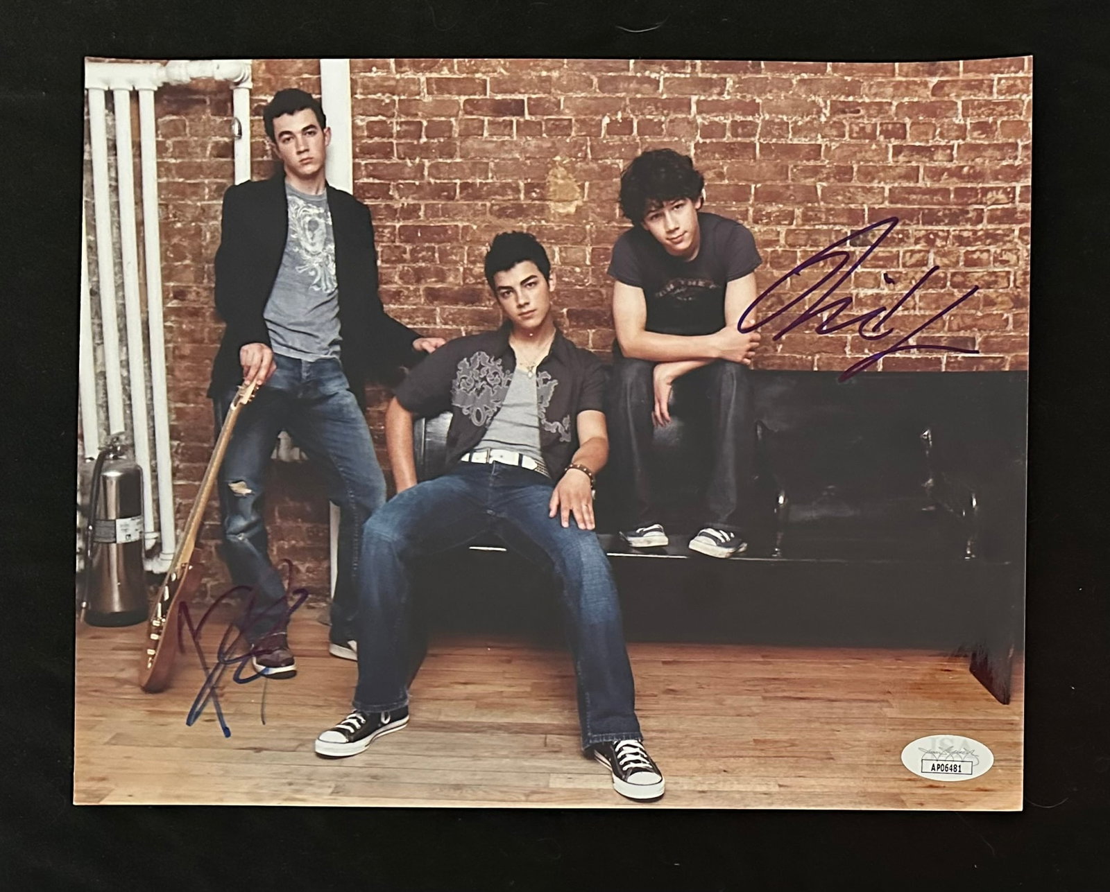 Jonas Brothers Signed Photo: An autographed photo of two of the Jonas Brothers; Nick and Kevin. Included with a JSA sticker of authenticity. Memorabilia, Autographs, Signatures, Collectibles, Music, Pop Culture Image: 8" x 10".