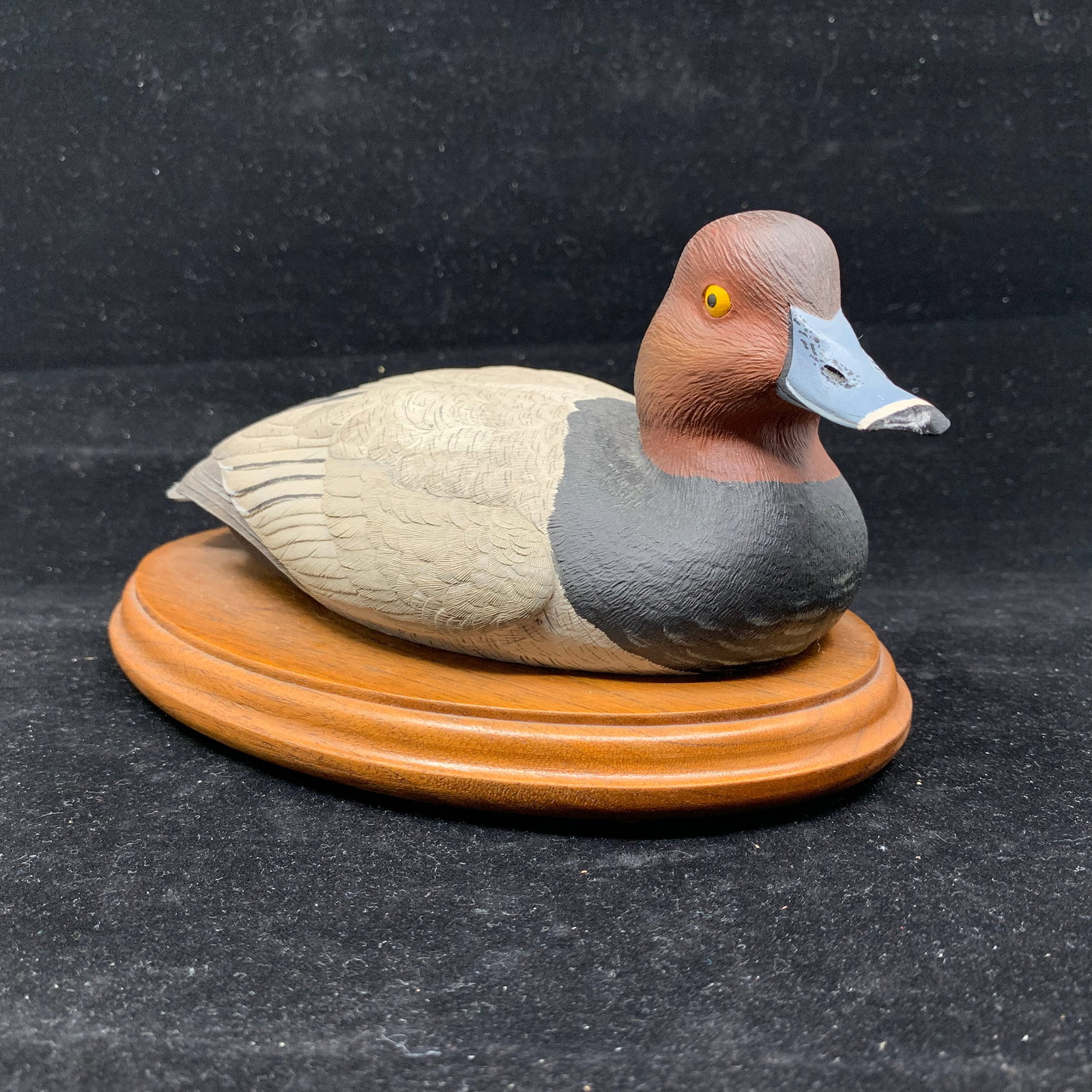 Paul Burdette's "Duck" Limited Edition AP Sculpture: Paul Burdette's limited edition duck carving, signed and numbered on the bottom, Artist Proof AP 3/45. A lovely duck, on a wood base. 7 3/4" x 5" x 4 1/4" tall.