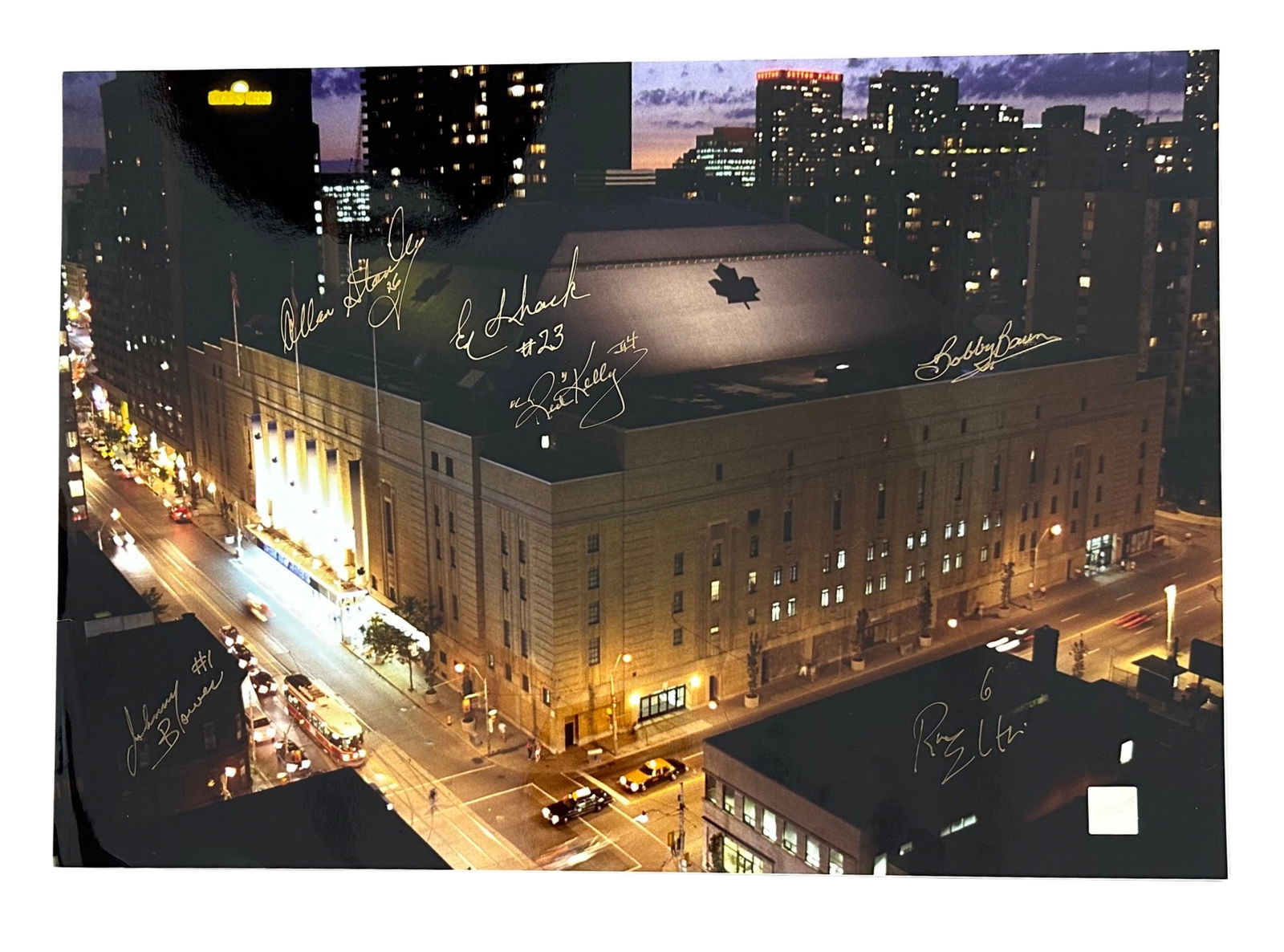 Maple Leafs Gardens 1967 at Night w/ 6 Signatures: A fantastic photo of Maple Leafs Gardens in 1967 at night with six signatures of players from the Toronto Maple Leafs that year when they won the Stanley Cup. Includes Red Kelly, Bobby Baun (very ligh