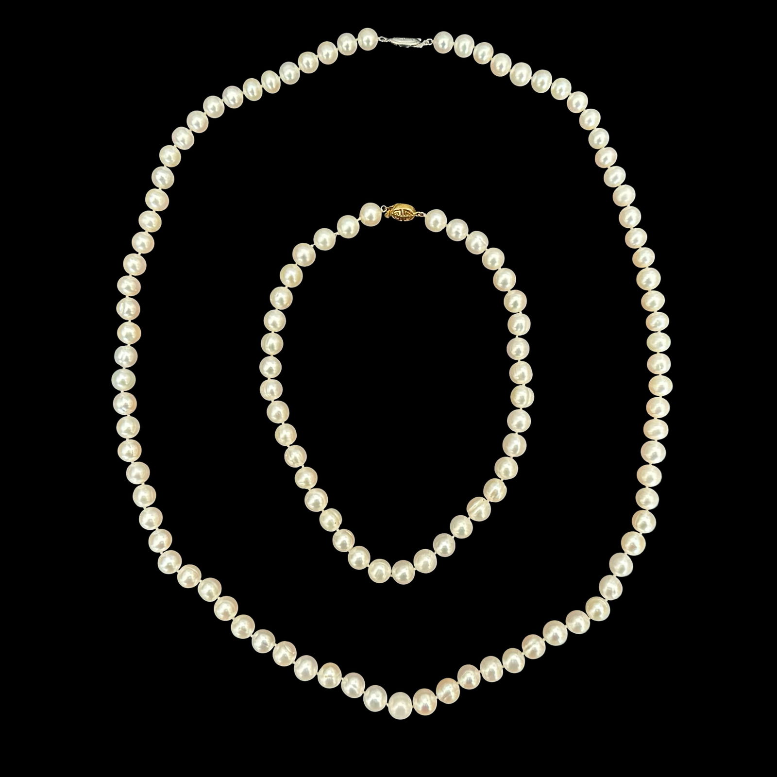 Matched Pair of Vintage Cultured Pearl Necklaces - 17 Inch and 34 Inch Strands - Hand-Knotted White: Presented here is an elegant and highly wearable matched pair of vintage cultured pearl necklaces, offered together as a refined and versatile set ideal for the discerning collector or sophisticated j