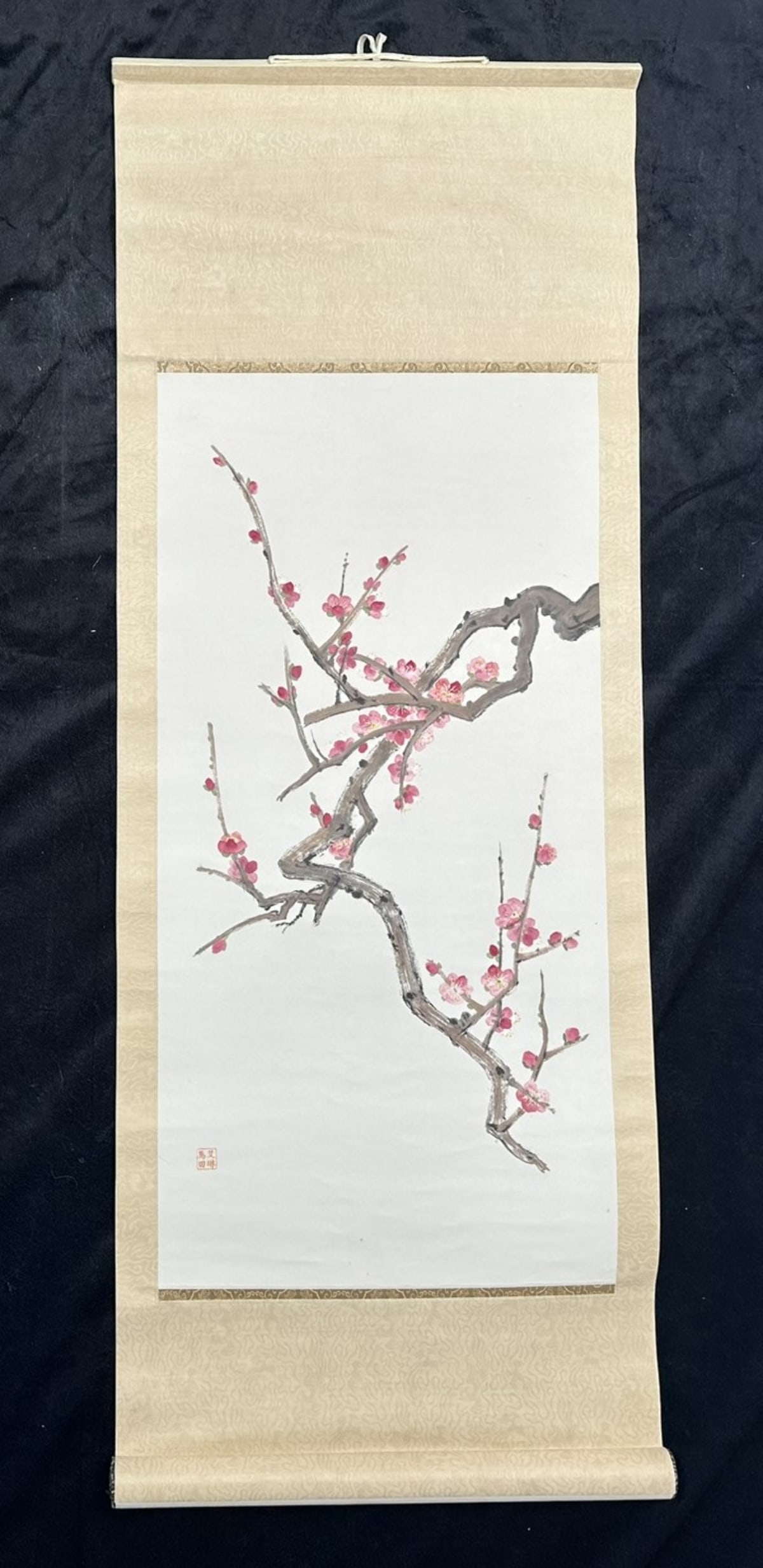 Chinese Scroll Painting: Chinese scroll painting of a plum blossom branch, signed lower left, in excellent condition. Image: 40" x 15"