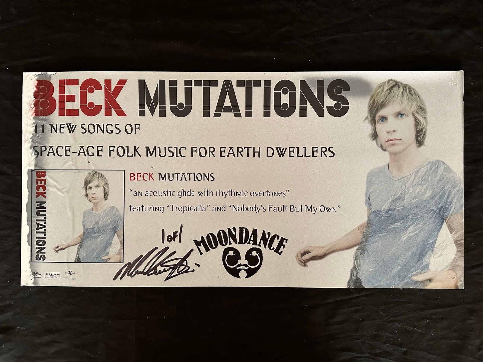 Beck "Mutations" Publicity Poster: Beck "Mutations" out of print Moondance cardboard publicity poster, signed 1 of 1. This piece shows very minor pinholes in the corners, some peeling upper right corner, and some major moisture issue a