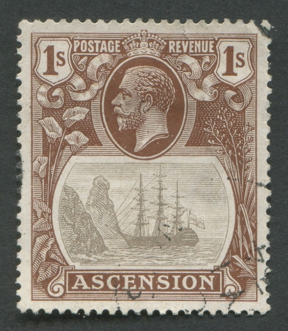 Ascension 1924 -1933 # SG18b, a used 1/- brown and gray with the "Torn Flag"variety, has a small (1 of 2)
