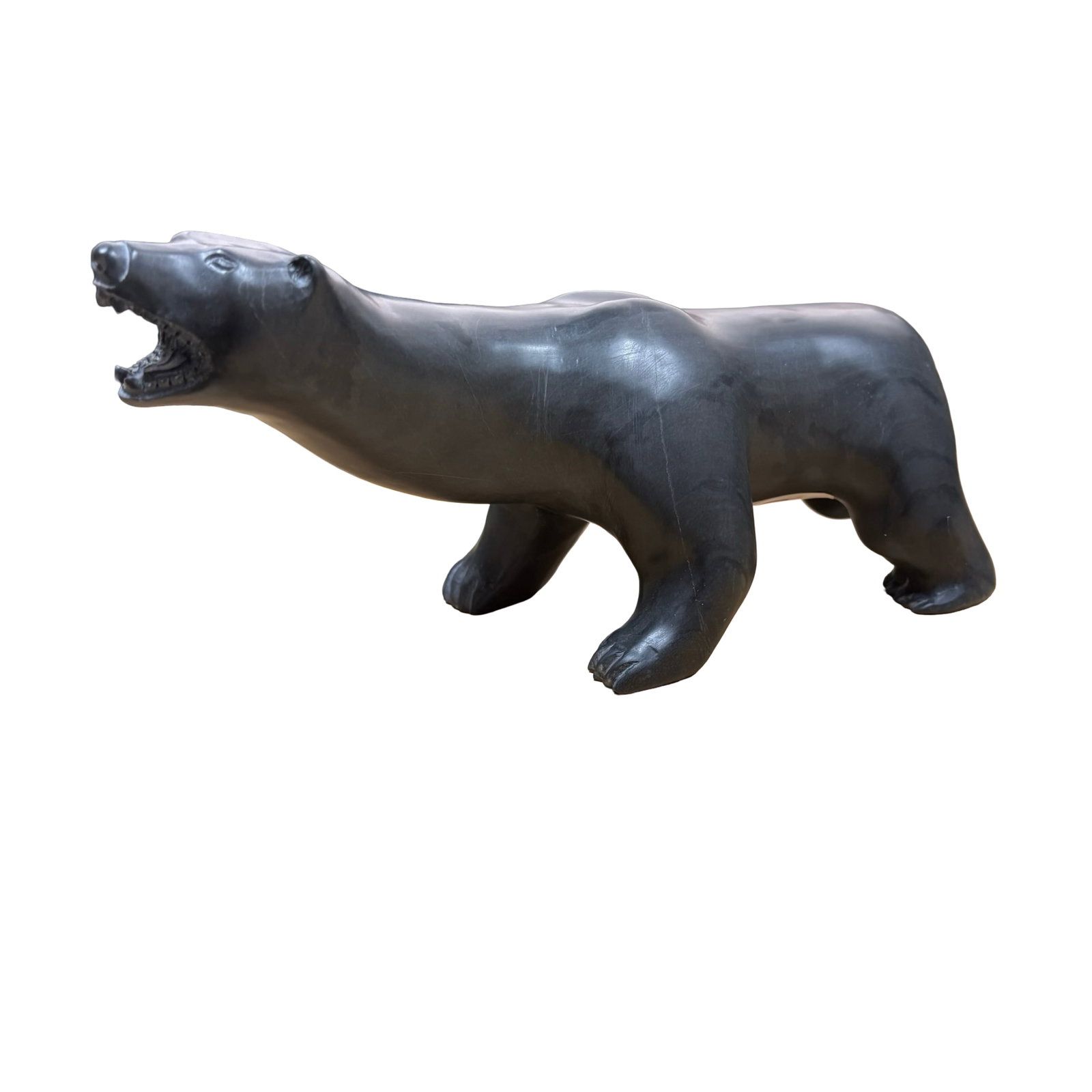 John Kawapik (Sanikiluaq) Monumental Walking Polar Bear - Masterfully Carved Inuit Stone Sculpture: John Kawapik (Inuk), Sanikiluaq, Nunavut, Canada, "Bear Walking," 2017. An exceptional hand-carved Inuit stone sculpture depicting one of the Arctic's most revered and enduring symbols, the polar bear