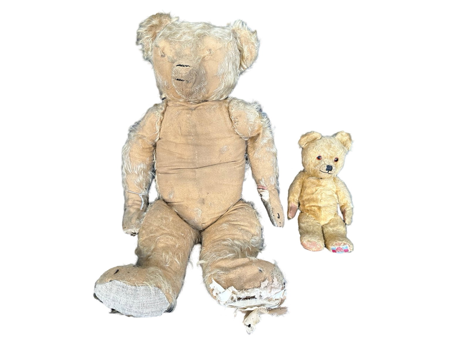 Antique Teddy Bears: Two antique teddy bears. Includes an all original 1920's Farnell Alpha, 14" tall, in very good condition with label on left foot, and a pre 1910 26" tall Merrythought, made in England. All joints are 