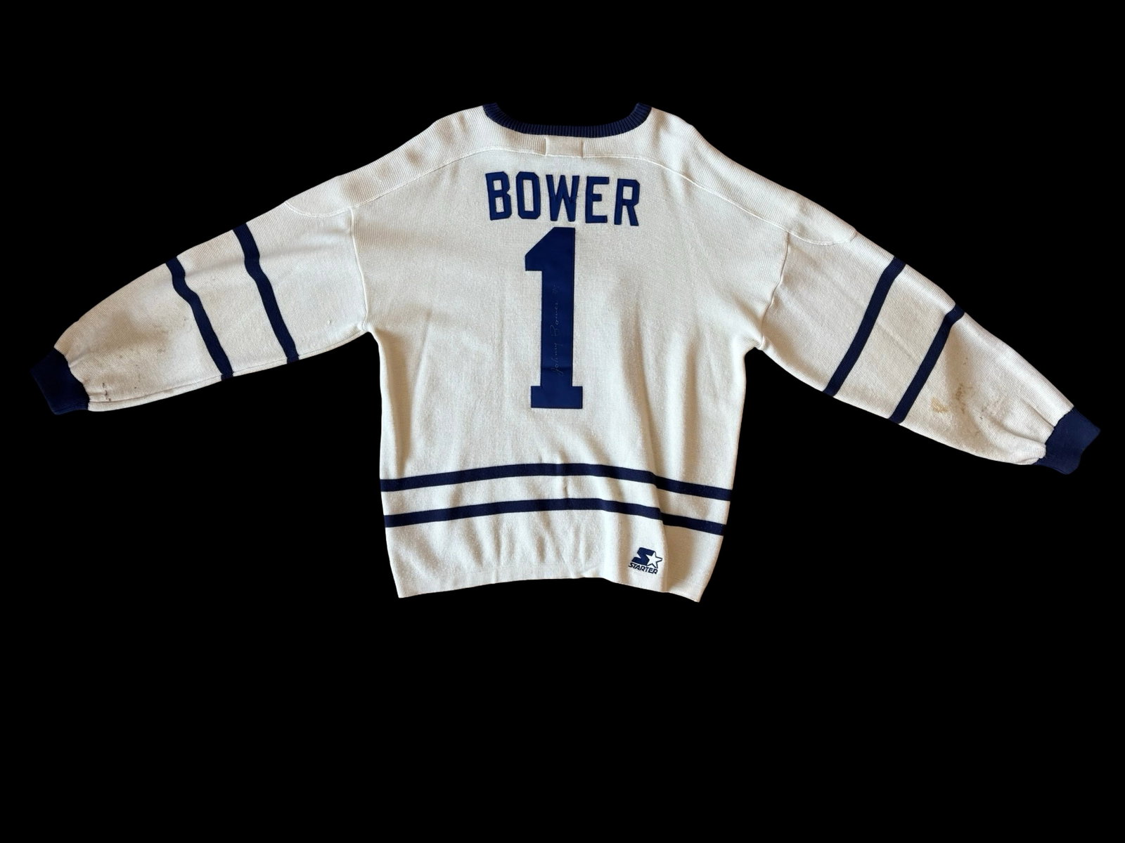Johnny Bower Signed Toronto Maple Leafs No. 1 Starter NHL Hockey Sweater Jersey - Hall of Fame: An exceptionally evocative piece of Toronto Maple Leafs memorabilia celebrating Hockey Hall of Fame goaltender Johnny Bower, featuring an officially licensed Starter NHL knit hockey sweater prominentl