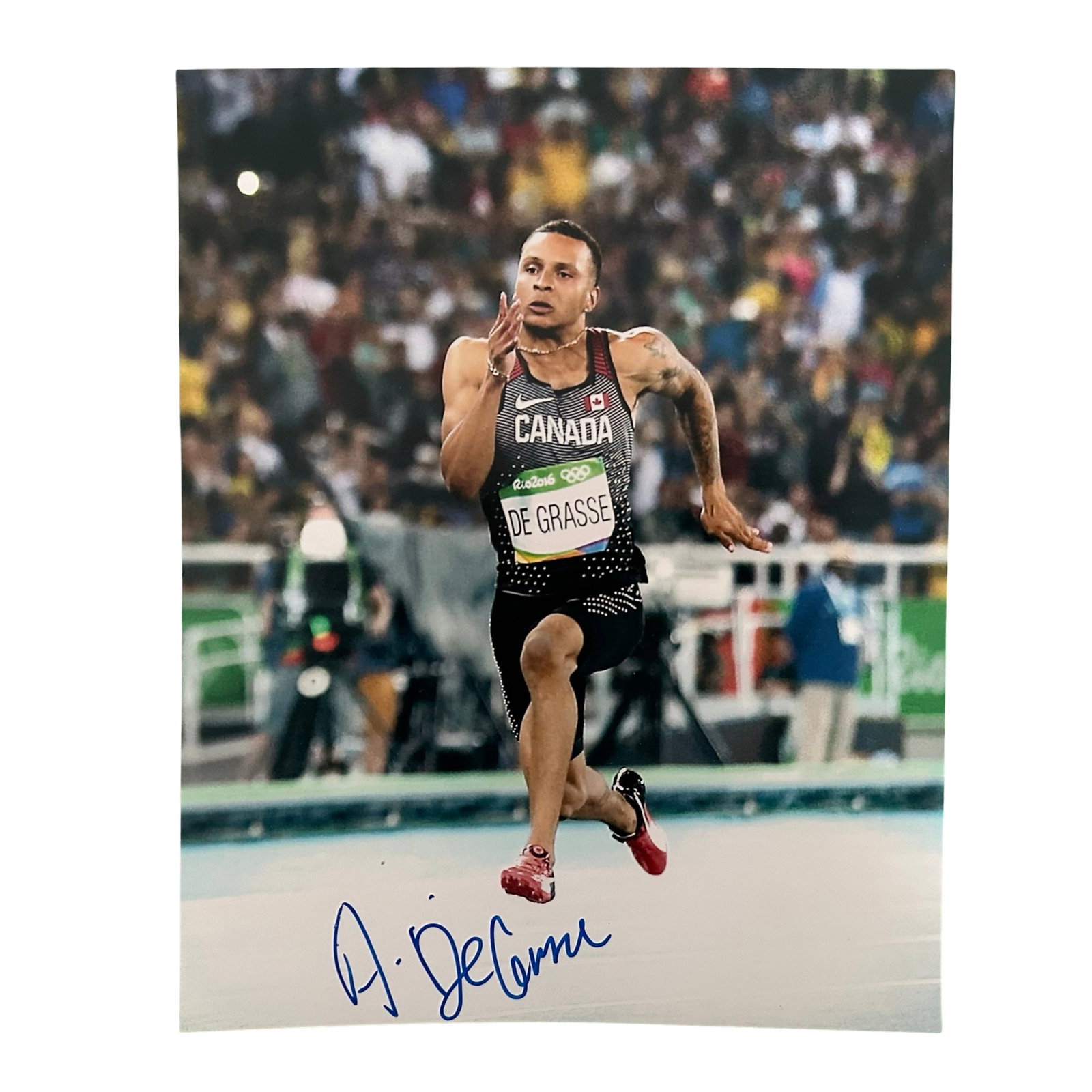 Andre de Grasse Signed Olympics Running Photo: An autographed Andre de Grasse 2016 Rio Olympic Games photo of him mid stride in his silver performance in the 200m sprint. Signature obtained at the Eaton's Centre Mall in Toronto, Ontario. Sports Me
