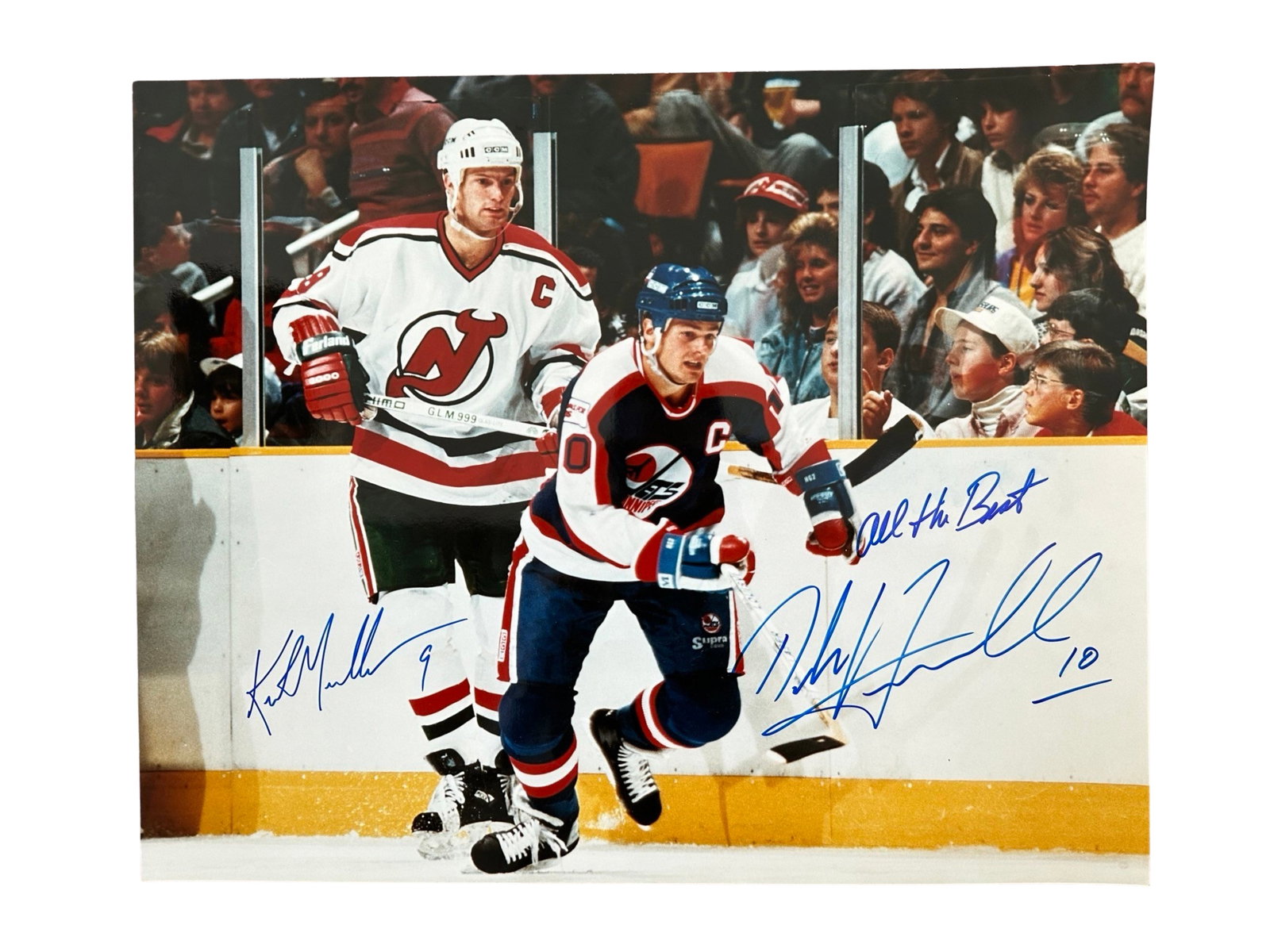 Kirk Muller & Dale Hawerchuk Signed Photo: An autographed photograph of Kurt Muller and Dale Hawerchuk during a game. An interesting piece as both were captains of the New Jersey Devils and Winning Jets at the time the photo was taken. Sports 