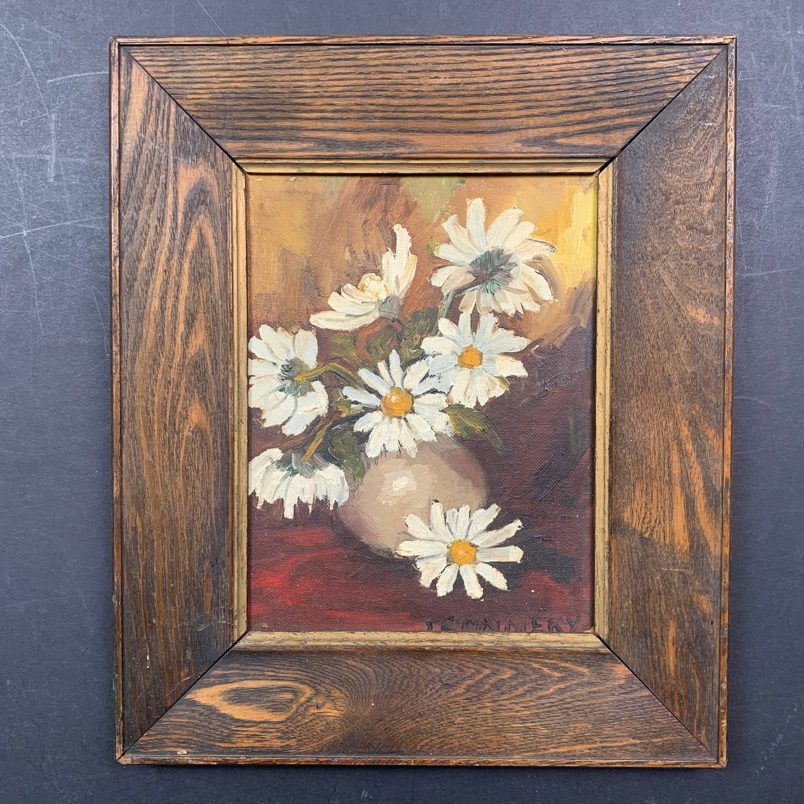 J. Connery Original: A J. Connery original acrylic on board painting, signed lower right. This piece is of a close up of a few daisies in a flower pot. This piece is in excellent condition. Image: 9" x 7". Frame: 13 1/4" 