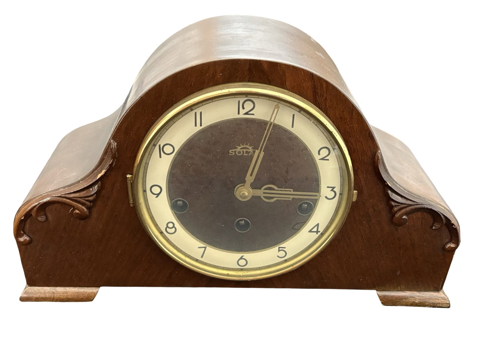 Mid-Century German Solar FHS Franz Hermle 8-Day Westminster Chime Tambour Mantel Clock in Carved: An evocative mid-20th-century German Solar mechanical mantel clock, distinguished by its handsome tambour-form wooden case, richly figured warm-brown finish and elegant carved foliate scroll ornament 