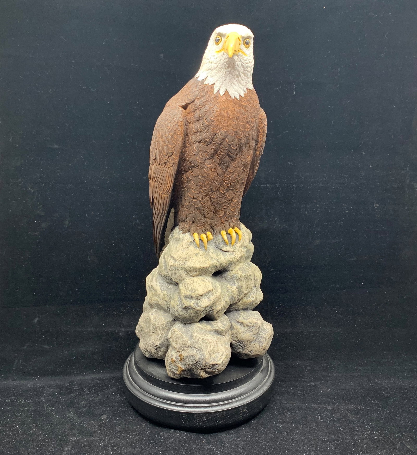 Paul Burdette's "Owl" Limited Edition AP Sculpture: Paul Burdette's limited edition owl carving, signed and numbered on the bottom, Artist Proof AP 2/15. A beautiful owl, perched on rocks, and supported by black base. 7" x 5 1/2" x 14 3/4" tall.