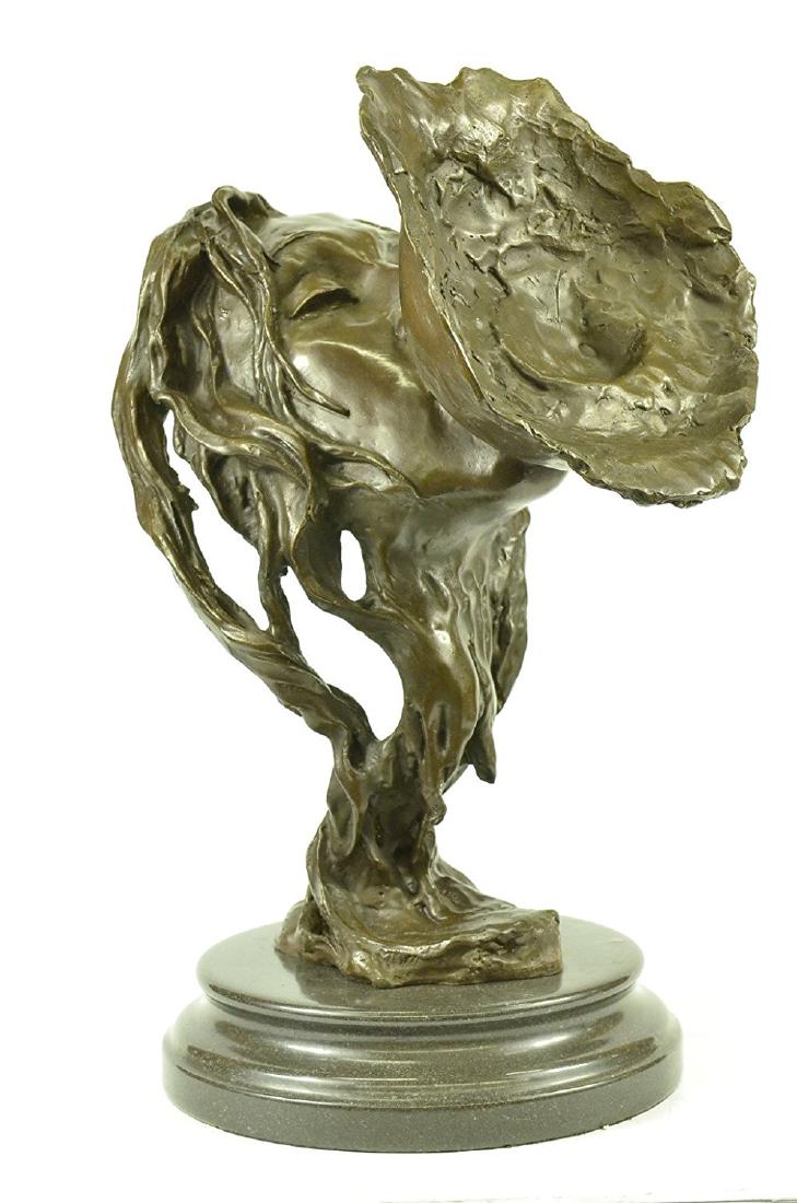 Lesbian Love Erotic Bronze Sculpture: This is a Bronze Sculpture featuring the face of a gorgeous woman embracing her lover. Her eyes are closed as she wraps her lips around the breast of her partner. Waves of her hair twist and shape to