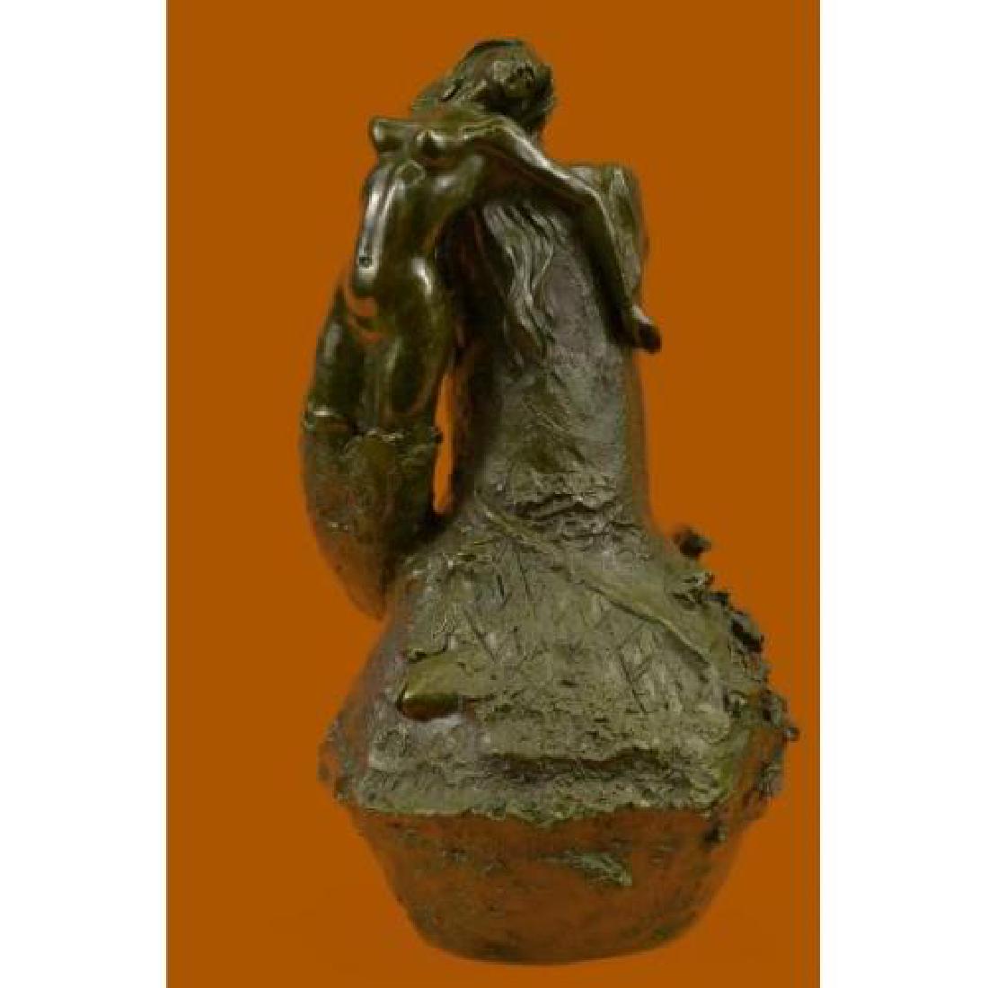 Nude Mermaid Vase Planter Bronze Sculpture: This is a gorgeous Bronze vase. It has an oval base shape and very decorative art nouveau handle in the form of a mermaid. The vase has a decorative design and the spout has a fish design. The handles