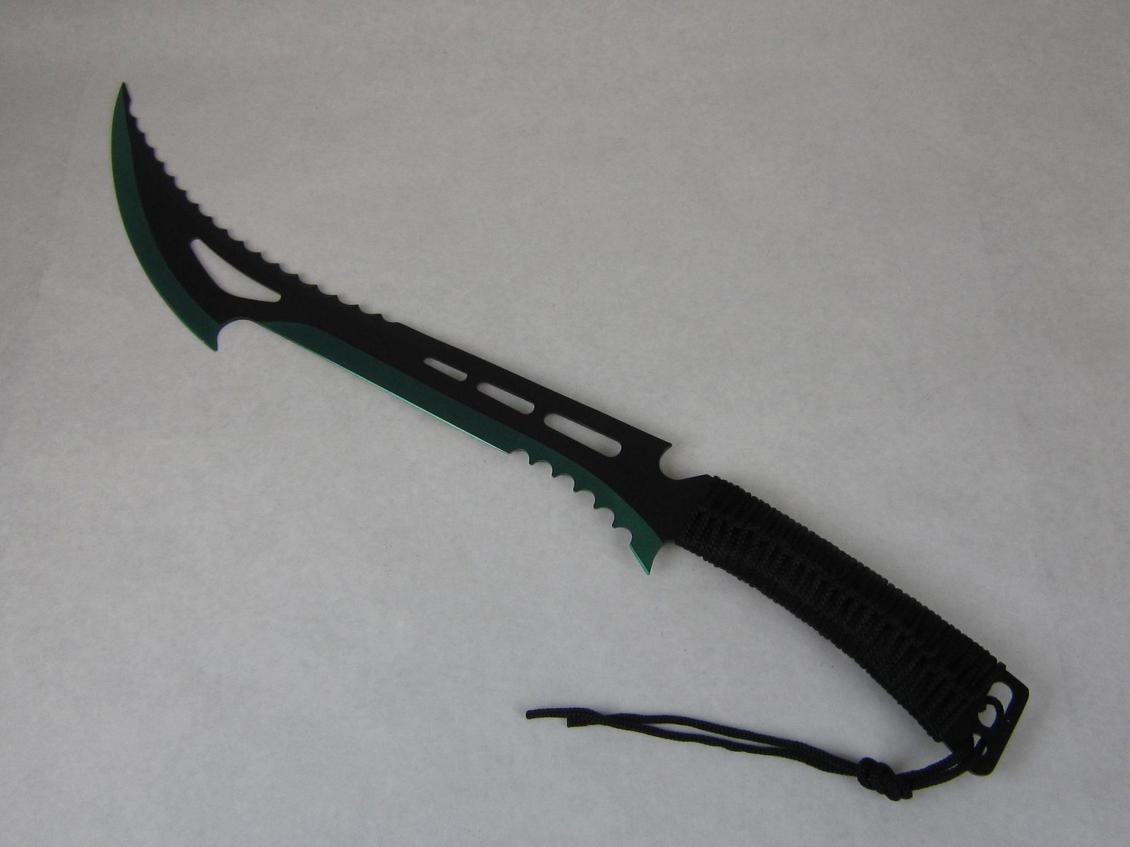 Snake Eye Tactical Zombie Killer Machete Two Tone Green: Constructed from a solid slab of heavy duty stainless steel, this full tang machete is a fearsome weapon. A versatile two tone green & black blade, sawbuck serrations on both sides allow this blade to