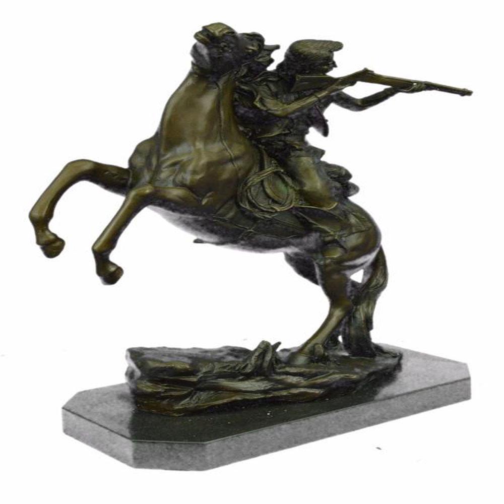 Outlaw Sheriff with Gun on Horse Bronze Statue: Its the Wild Wild West. This gunslinger, comfortable on his rearing horse, looks over the horses neck to watch ahead for his enemy. Hes ready to fire his weapon if need be as he travels hurriedly thro