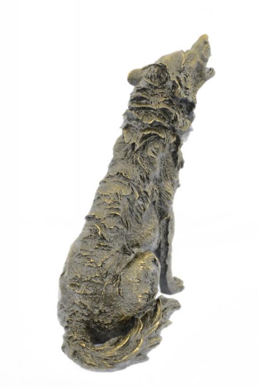 Wolf Howling at The Moon Bronze Sculpture: This is a stunning bronze sculpture featuring a stand alone wolf. His posture is tall and head is raised toward the full moon as he releases a high pitched howl. The artist has captured the detailing