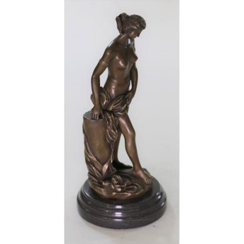 Artwork Woman Female Bronze Sculpture: The bronze Venus, completely nude is found pushing away her flowing locks from her delicate face, as she pulls the enchanted beholder to stare and stare at her. There is something magnetic in the time