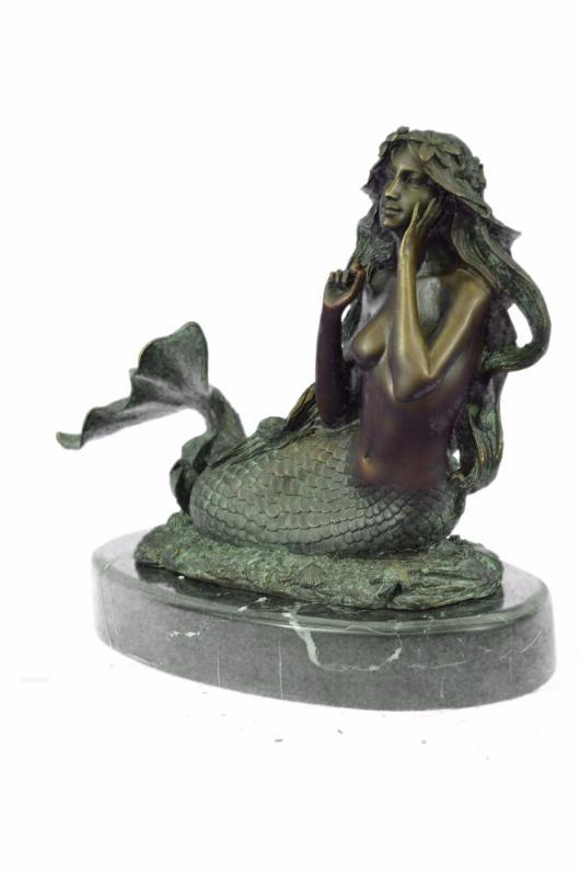 Bronze Mermaid Sculpture with Green Patina: Many people find the mystery of mermaids enchanting, and if youâ€™ve spent much time out to sea, you might have a mermaid story of your own to tell. (Donâ€™t embellish too much, you might be