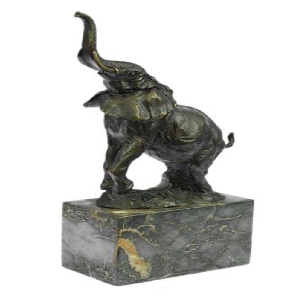 African Elephant Bronze Statue: The elephant can be envisioned tracking slowly and majestically across the ceaseless dryness of a plain in search of a watering hole or the shade of trees. He pulls his trunk outward as he passes on b
