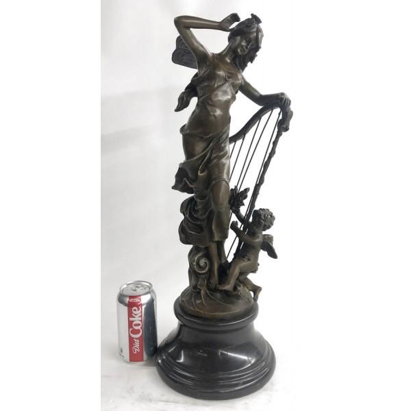 Art Deco Butterfly Angel Nymph Fairy Fantasy Art: A young cherub reaches to a fairy to gain her attention. The beautiful fairy reaches back to the cherub with a delicate to his playful curls. She is holding a musical Harps in this enchanting sculptur