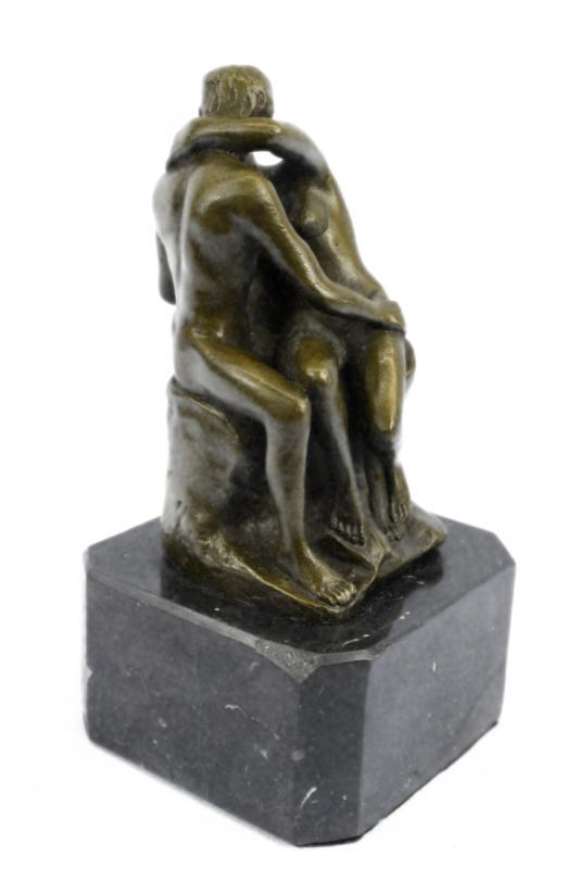 Famous Kiss Bronze Sculpture: This is a bronze replica of "The Kiss" (1889) by the famous French sculptor, Auguste Rodin. The embracing couple depicted in the sculpture appeared originally as part of a group of reliefs decorating