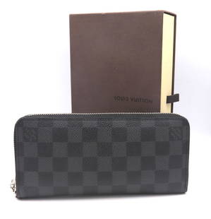 Authentic Designer Louis Vuitton Damier Graphite Canvas Vertical Wallet: Preowned Authentic Designer Louis Vuitton Damier Graphite Canvas Vertical Wallet. The Wallet has a wide zip Closure which opens to reveal multiple slots. Leather lined, Compartments and zip pocket. Co