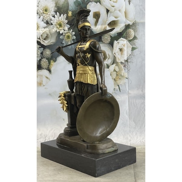 Greek Warrior Roman Soldier Bronze Sculpture: The Roman legion soldier stands nude, except for some regalia, looking to the horizon of a scarred battlefield. On the top of his head, he wears a galea, which is a soldier helmet. A baldric straps ac