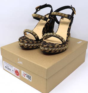 Christian Louboutin Nappa Silk Leopard Pira Ryad 110 Wedge Sandals 36 Black Marron: Preowned Authetic Pair of Christian Louboutin Nappa Silk Leopard Pira Ryad 110 Wedge Sandals 36 Black Marron. The wedge features an adjustable black leather ankle straps and lined in gold pyramid stud